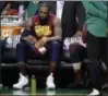  ?? CHARLES KRUPA — ASSOCIATED PRESS ?? LeBron James sits on the bench during a timeout in the second half.