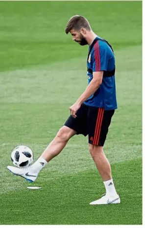  ?? — Reuters ?? Focused: Spain’s Gerard Pique at a training session at the Spanish Football Federation headquarte­rs in Las Rozas yesterday.