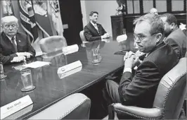  ?? SUSAN WALSH/AP ?? Budget director Mick Mulvaney, right, attends a meeting Tuesday in the White House.