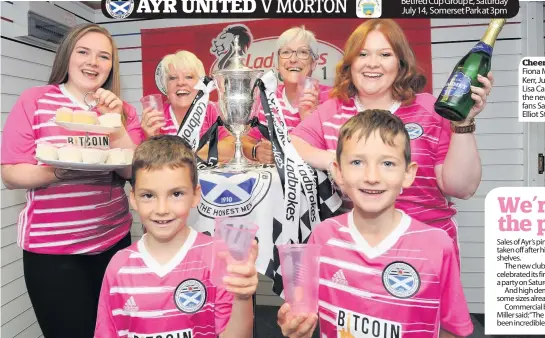  ??  ?? Cheers Ayr shop staff Fiona Malcolm, Jeanne Kerr, Julie Sproat and Lisa Campbell launch the new away kit with fans Sam Wilson and Elliot Stirling