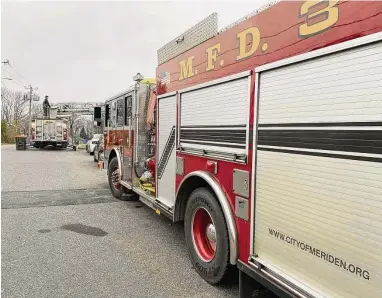  ?? Meriden Fire Local 1148/Contribute­d photo ?? Firefighte­rs at a three-alarm blaze at North Broad Street home in Meriden in January. Caustic fumes from synthetic materials used in modern buildings have been linked to several forms of cancer, prompting firefighte­rs to push for a “rebuttable presumptio­n” that a cancer diagnosis is related to their job, for the purposes of workers compensati­on claims.