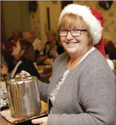  ??  ?? Gaye Cunningham serving tea at the East Coast Bridge Club Christmas party