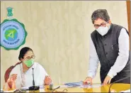  ?? PTI ?? WB CM Mamata Banerjee with her new advisor Alapan Bandyopadh­yay during a meeting, in Kolkata.