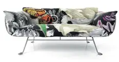  ?? ALLMODERN.COM ?? Marcel Wanders’ textile print Flower Bits, with an abstract of flowers and butterflie­s, enlivens the Nest pillow set for this Moooi’s sofa. Fashion’s dark florals have captured the interest of interior designers, too.