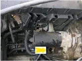  ??  ?? This yellow arrow shows the position of the crankshaft position sensor and why the manifold has to come off. Above the starter is the wiring junction box and the crankcase ventilatio­n system, secured to the inlet manifold by two 10mm nuts.