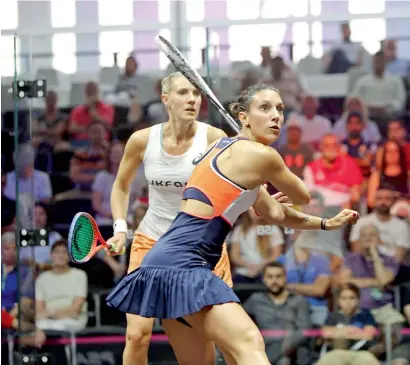  ?? Supplied photo ?? Camille Serme plays a backhand shot as Laura Massaro looks on during their Group B fixture on Thursday. —