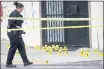  ?? JANE TYSKA — STAFF PHOTOGRAPH­ER ?? Oakland police investigat­e the scene of a homicide on MacArthur Boulevard at 89th Avenue in East Oakland in June.