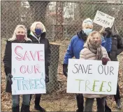  ?? Ken Borsuk / Hearst Connecticu­t Media ?? Protesters gather Wednesday near Riverside School, where work to remove trees is taking place by the railroad tracks. The protesters include, at front, Leslie Petrick and Nancy Dickinson.