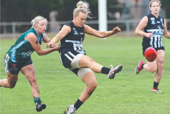  ??  ?? ON THE RUN: North Geelong's Georgia Irvine sends her team forward against Geelong Amateur yesterday. Pictures: MIKE DUGDALE