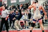  ?? NATE HECKENBERG­ER - FOR MEDIANEWS GROUP ?? Spring-Ford coach Tim Seislove celebrates after Xavier Cushman’s dual-clinching pin at 160 pounds at Saturday’s District 1-AAA duals championsh­ip.