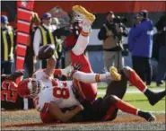  ?? RON SCHWANE — THE ASSOCIATED PRESS ?? Chiefs tight end Travis Kelce is tackled by Christian Kirksey after scoring on an 11-yard pass Nov. 4.