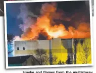  ?? Pictures: AP, GETTY ?? Smok Smoke and d fl flames from the multistore­y shopping centre in Kemerovo.