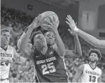  ?? YOUNG KWAK THE ASSOCIATED PRESS ?? Utah State forward Dwayne Brown Jr. grabs a rebound in front of teammate guard DeAngelo Isby during Saturday’s game against Gonzaga in Spokane, Wash.