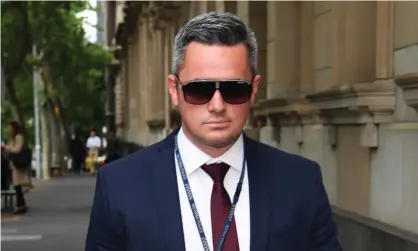  ?? Photograph: James Ross/AAP ?? Det Sr Const Murray Gentner is facing six charges relating to former AFL coach Dani Laidley’s arrest. His lawyer says the matter has ‘not resolved and I doubt will resolve’.