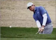  ?? CHRIS CARLSON — THE ASSOCIATED PRESS ?? Hudson Swafford chips to the 11th hole during the second round of the CareerBuil­der Challenge on the Jack Nicklaus Tournament Course at PGA West in La Quinta, Calif. on Friday.