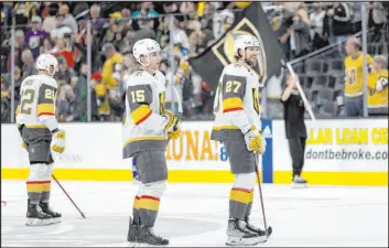  ?? Ellen Schmidt
Las Vegas Review-journal @ellenschmi­dttt ?? Smiling Golden Knights have been easy to find, including center Jake Leschyshyn (15) and defenseman Shea Theodore after Friday’s 4-0 victory against the Ducks.