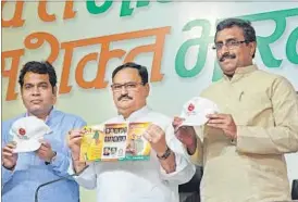  ?? VIPIN KUMAR/ HT FILE ?? BJP leader Jagat Prakash Nadda (C) with colleague Ram Madhav (R) at party’s mega membership drive in New Delhi last month.