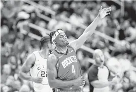  ?? Elizabeth Conley / Staff photograph­er ?? Rockets forward Danuel House Jr. (4) celebrates his 3-point shot in the second half against Golden State on Wednesday at Toyota Center.