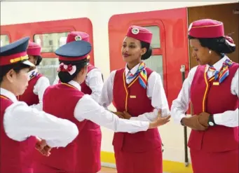  ?? XINHUA ?? Stewardess trainees for the Ethipia-Djibouti railway, a China-supported project, receive etiquette instructio­n from their Chinese counterpar­ts in Addis Ababa, Ethopia, on Saturday. The new railway's launch was celebrated on Wednesday.