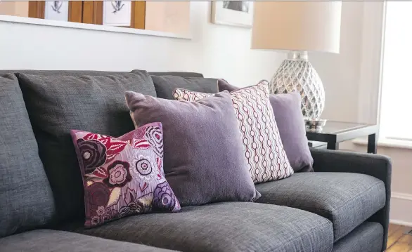  ?? KENDALL ANSELL ?? Kendall Ansell, a Vancouver-based interior designer, says using throw pillows with “pops of bold Ultra Violet will stand out beautifull­y” in rooms with neutral palettes.