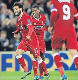  ??  ?? Mohamed Salah celebrates after putting Liverpool 2-1 up.