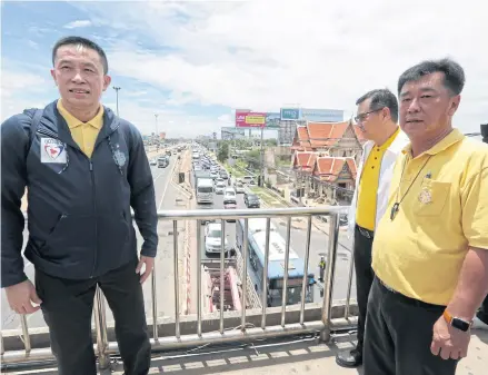  ?? CHANAT KATANYU ?? Transport Minister Saksayam Chidchob, left, inspects a road improvemen­t project in Bangkok late last month.