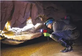  ?? STAFF PHOTOS BY DOUG STRICKLAND ?? Pallavi Sirajuddin with Georgia DNR searches for bats in Frick’s Cave on Saturday.