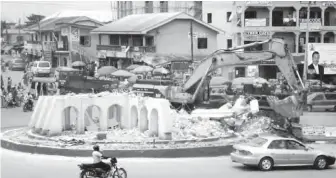  ??  ?? Demolition of Arroma Roundabout, Awka, on the Enugu – Onitsha Expressway yesterday. Pic: NAN