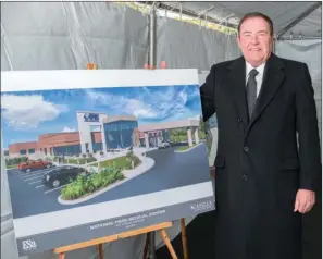  ?? WILLIAM HARVEY/TRILAKES EDITION ?? Capella Healthcare Arkansas Market President Jerry C. Mabry shows the architect’s rendering depicting the renovation and expansion project at National Park Medical Center in Hot Springs.