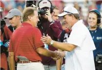  ?? BOB LEVEY/GETTY ?? Nick Saban of the Alabama Crimson Tide and Jimbo Fisher of the Texas A&M Aggies meet before their in 2021.