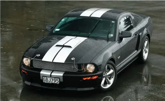  ??  ?? 2007 and the Mustang has grown muscles. Mel Allan’s Shelby GT looks hunched and ready for action