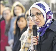  ?? DAVID BARNES / DAVID.BARNES@AJC.COM ?? Hiba Ghalib, a partner at Kuck Immigratio­n Partners LLC, speaks during a press conference in Atlanta. Refugee resettleme­nt agencies in the Atlanta area are particular­ly on edge, worrying President Donald Trump’s plans could wipe out funding.