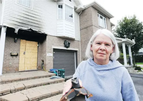  ?? JEAN LEVAC ?? Vicky Earl cannot begin reconstruc­tion on her townhouse, damaged by a fire in July, until her neighbour’s insurance issues are settled.