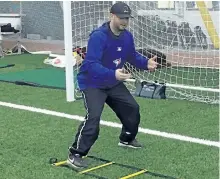  ?? SUBMITTED PHOTO ?? Garrett Fitzgerald working with infielders on foot work drills during the new PBA skills developmen­t program for its rep Tigers teams at the Hastings Field House on Saturday.