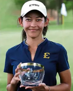  ??  ?? Proud moment: Warda Amira is all smiles after claiming her maiden collegiate title in the United States.