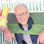  ?? Gordon Robbie. Picture: ?? Bill Anderson takes a turn in the stocks at a previous fair.