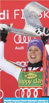  ??  ?? SOELDEN: Germany’s Viktoria Rebensburg celebrates on the podium after winning an alpine ski, women’s World Cup giant slalom in Soelden, Austria, yesterday. — AP