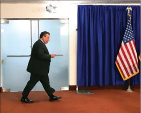  ?? MELEVANS/AP ?? New Jersey Gov. Chris Christie walks in to address the media on July 3 in Trenton, N.J. A Morning Consult poll on Tuesday found Christie to be the least popular governor in the entire country. The collapse of Christie’s political fortunes are a...