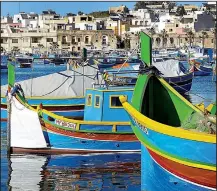  ?? Rick Steves’ Europe/GRETCHEN STRAUCH ?? According to tradition, the colors of these Maltese fishing boats represent a fisherman’s home village.