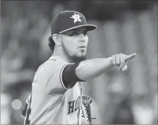  ?? Canadian Press photo ?? Houston Astros pitcher Roberto Osuna points to the Blue Jays dugout after getting the last out to defeat his former team in the bottom of the ninth inning of their American League MLB baseball game in Toronto on Monday.