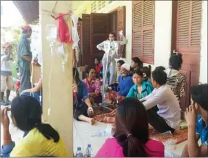  ?? SUPPLIED ?? Workers take IV drips after a mass fainting at a garment factory in 2015 in Kandal province. Recent ethnograph­ic research sheds light on the factors influencin­g mass fainting in recent years.