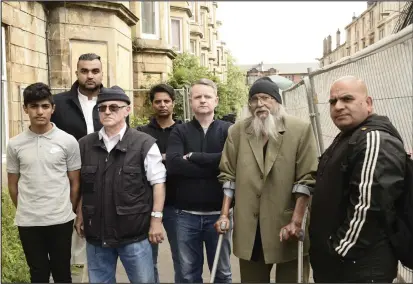  ??  ?? Residents and owners from 37 Annette Street in Govanhill in front of the block Photo: Jamie Simpson