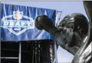  ??  ?? The Rocky statue stands in view of the stage being constructe­d for the upcoming 2017NFL football draft on the steps of the Philadelph­ia Museum of Art in Philadelph­ia, Tuesday. When the NFL chose Philadelph­ia to host the 2017draft, they insisted on...