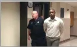  ?? CARL HESSLER JR. — DIGITAL FIRST MEDIA ?? Jahleel C. Davis, 19, of Pottstown, is escorted to Montgomery County courtroom for trial on charges of attempted murder, conspiracy to commit murder, aggravated assault and possessing instrument­s of crime.