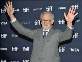  ?? Evan Agostini Invision / Associated Press ?? DIRECTOR Steven Spielberg greets the crowd at the Toronto Internatio­nal Film Festival in Canada for the premiere of his movie memory piece, “The Fabelmans.”
