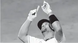  ?? JAYNE KAMIN-ONCEA/GETTY ?? Angels’ Albert Pujols points to the sky after hitting the 662nd home run of his career.