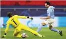  ??  ?? Ilkay Gündogan pokes the ball past Yann Sommer to end a flowing move and put Manchester 4-0 up on aggregate. Photograph: Getty Images