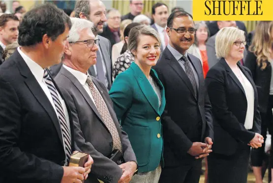  ?? PATRICK DOYLE/THE CANADIAN PRESS ?? Dominic LeBlanc, from left, Jim Carr, Mélanie Joly, Amarjeet Sohi and Carla Qualtrough attend a swearing-in ceremony at Rideau Hall in Ottawa on Wednesday.