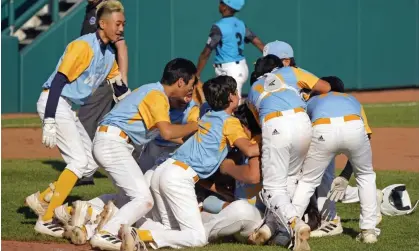  ?? Photograph: Tom E Puskar/AP ?? Members of the Honolulu Little League team celebrate their win against Curacao.