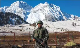  ?? China. Photograph: Farooq Khan/EPA ?? An Indian paramilita­ry soldier stands guard near the Zojila tunnel, more than 3,000 metres above sea level, which will connect Kashmir Valley and Ladakh on the border with